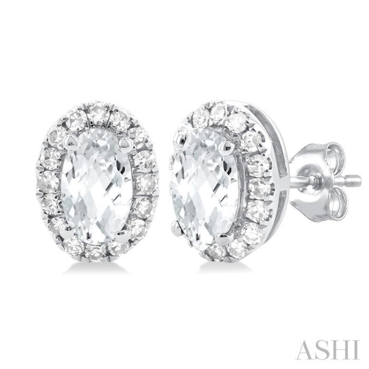 5x3 MM Oval Shape White Topaz and 1/8 Ctw Single Cut Diamond Halo Semi-Precious Stud Earrings in 14K White Gold