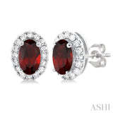 5x3 MM Oval Shape Garnet and 1/8 Ctw Single Cut Diamond Halo Semi-Precious Stud Earrings in 10K White Gold