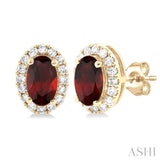 5x3 MM Oval Shape Garnet and 1/8 Ctw Single Cut Diamond Halo Semi-Precious Stud Earrings in 10K Yellow Gold