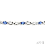 4x3mm Oval Cut Tanzanite and 1/10 Ctw Round Cut Diamond Bracelet in 10K White Gold