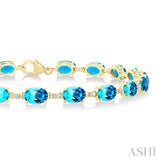 6X4 MM Oval Cut Blue Topaz and 1/6 Ctw Round Cut Diamond Semi-Precious Tennis Bracelet in 10K Yellow Gold
