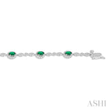 5x3 MM Oval Cut Emerald and 1/20 Ctw Single Cut Diamond Bracelet in 10K White Gold