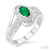 6x4 MM Oval Cut Emerald and 1/50 Ctw Round Cut Diamond Ring in Sterling Silver